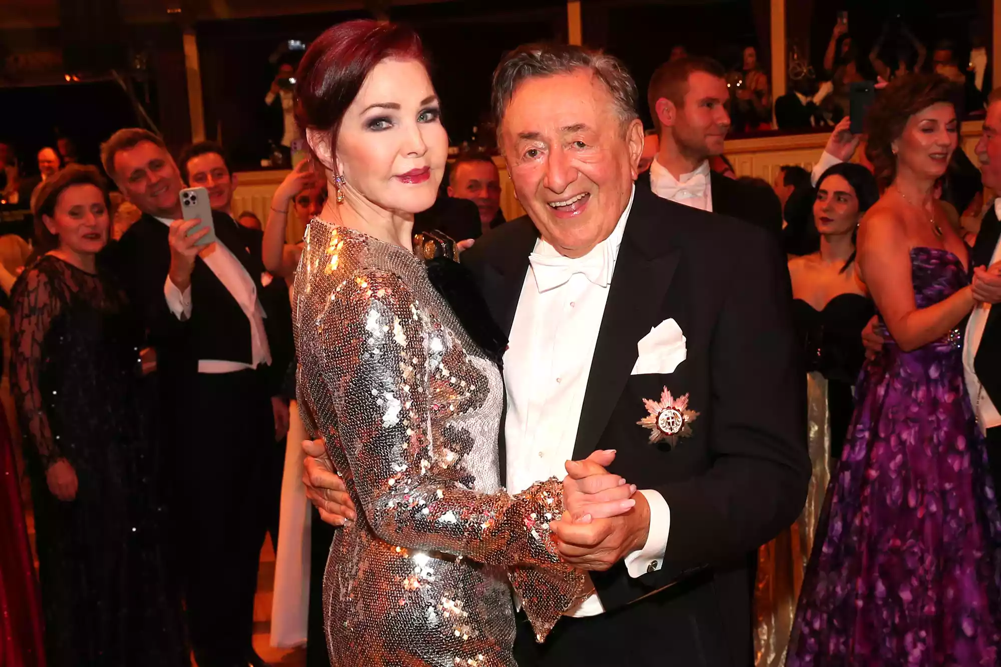 Priscilla Presley and Richard Lugner dance during the Vienna Opera Ball (Wiener Opernball) 2024 at Vienna State Opera on February 8, 2024 in Vienna, Austria.